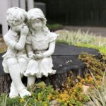 A Fairy Garden with Plants Stump Statue