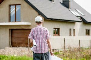 Construction worker walking to house