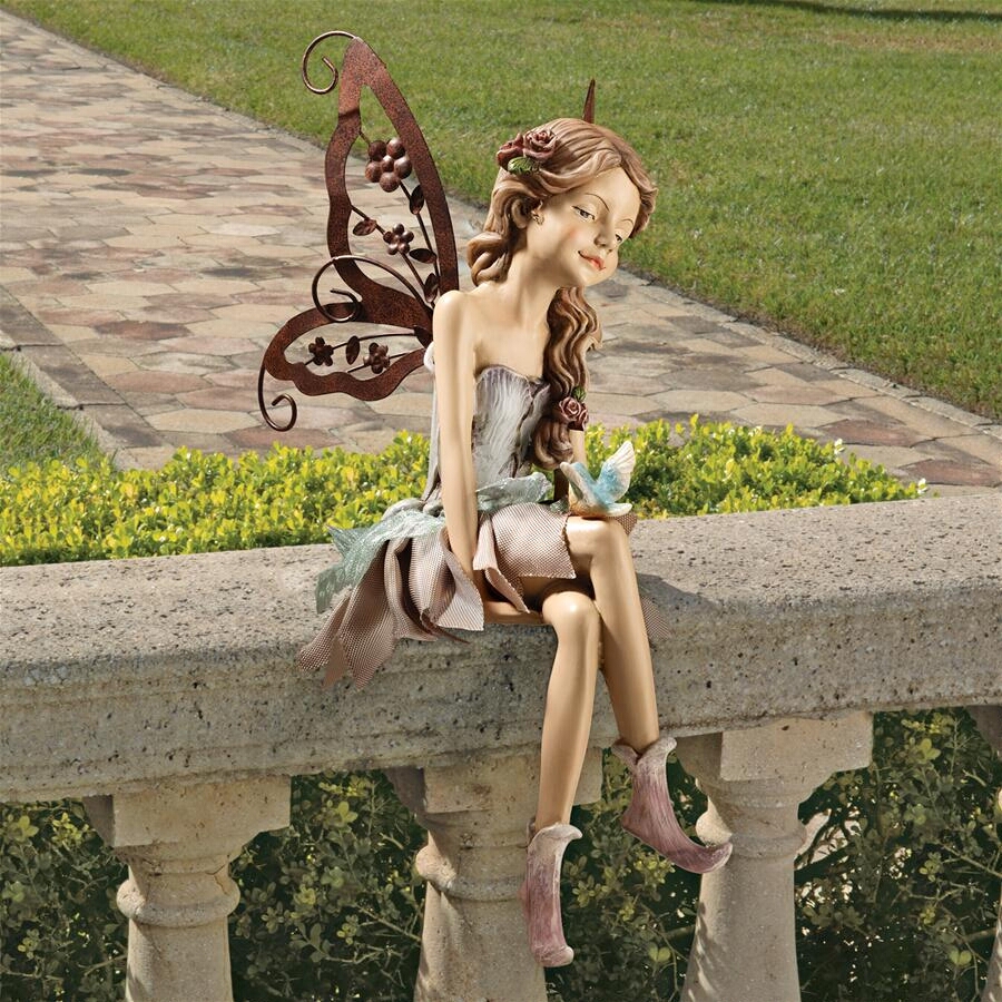 kissing fairy statue