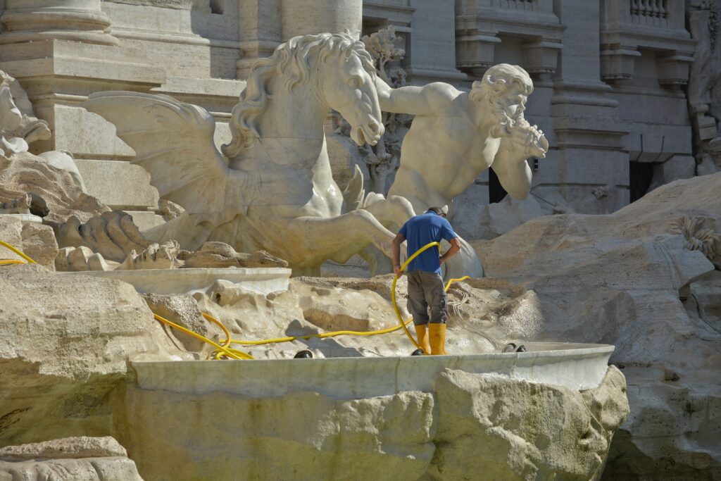 Man-cleaning-Giant-Statue-Photo-by-David-Edkins-on-Unsplash